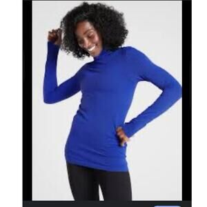 ATHLETA Flurry Peak Turtleneck Lg
Women Tanzanite Blue Black Thumbhole Raw Hem